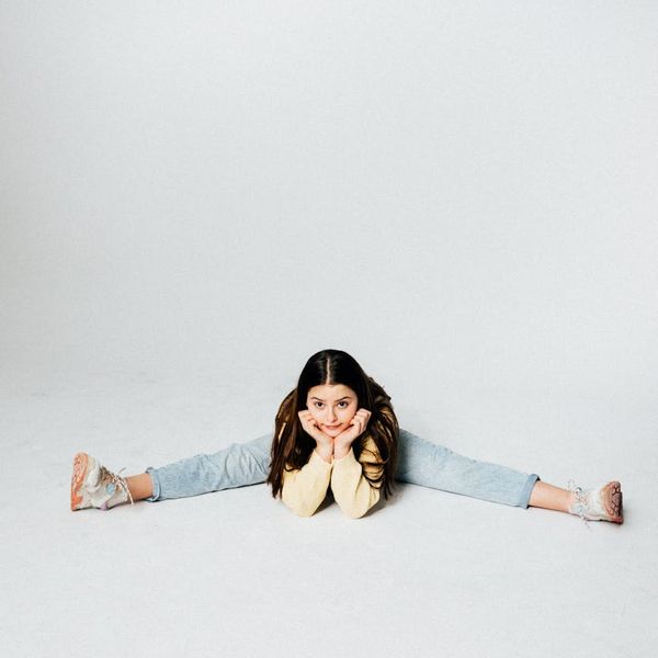 Portrait of a smiling yoga instructor Svitlana in a studio.